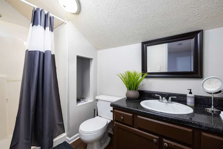 Modern bathroom with updated fixtures, fresh towels, and a clean design. Modern bathroom with updated fixtures, fresh towels, and a clean design.