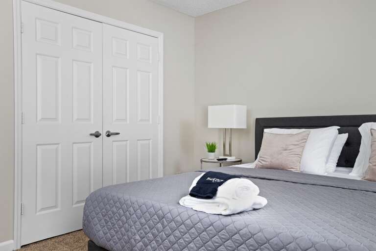 Cozy bedroom with a king-size bed, fresh linens, and soft lighting for a relaxing stay. Cozy bedroom with a king-size bed, fresh linens, and soft lighting for a relaxing stay.