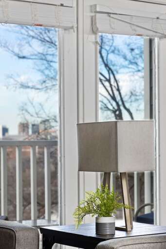 Close-up of a side table with modern decor, highlighting attention to detail and comfort. Close-up of a side table with modern decor, highlighting attention to detail and comfort.