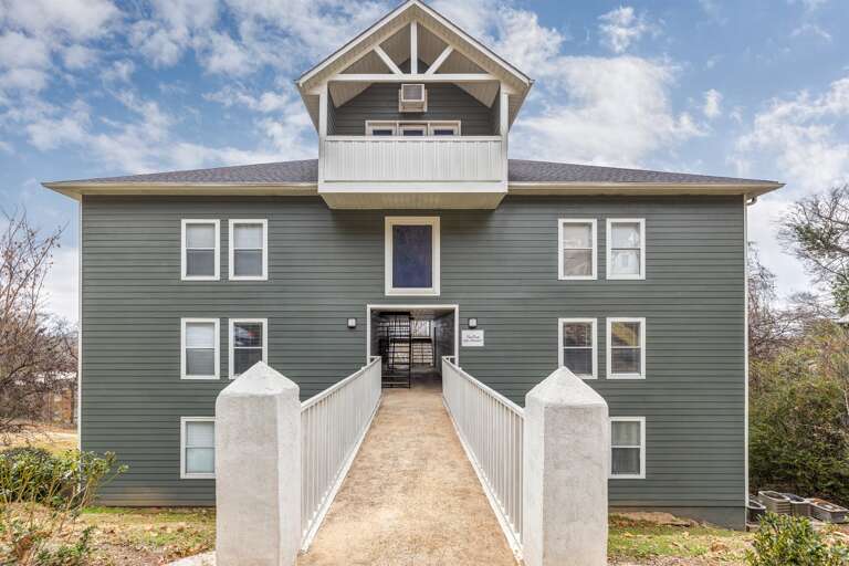 Front view of the building featuring a welcoming walkway and unique architectural details.