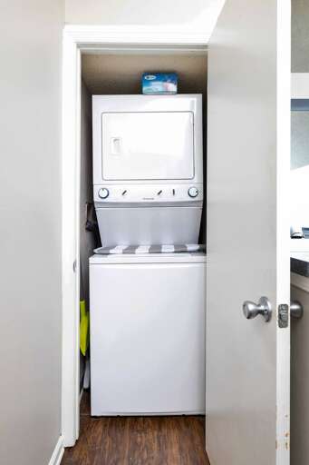 Compact washing machine in a dedicated closet, ideal for quick and convenient use during your stay.