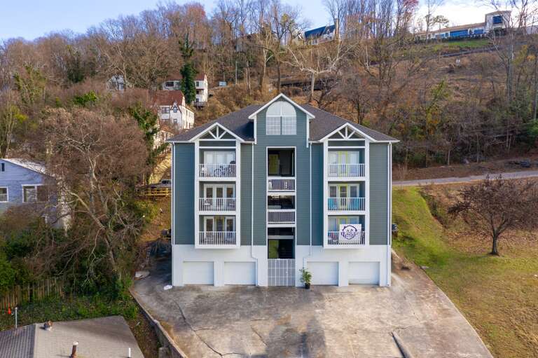 Rear view of the property showcasing private balconies and the surrounding peaceful neighborhood.