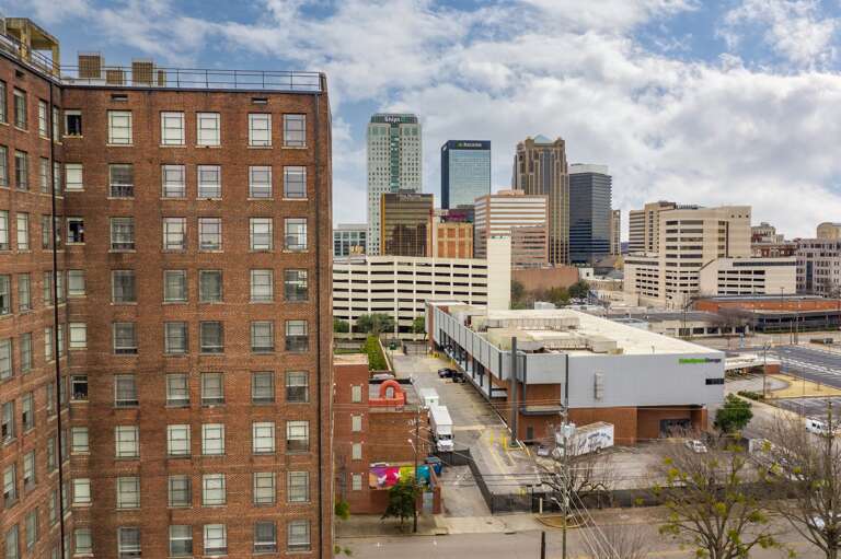 Panoramic city views highlighting the dynamic urban skyline from the shared spaces.