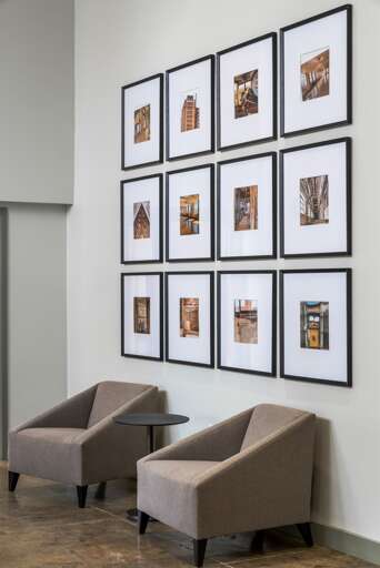 Comfortable seating area with chic furnishings and modern wall art for a sophisticated touch.