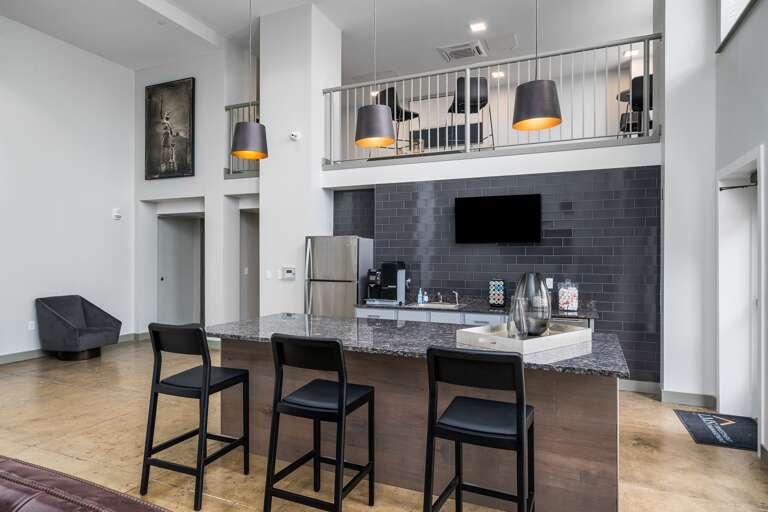 Common kitchen area equipped with ample counter space and modern amenities for group gatherings.