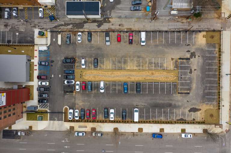 Aerial view of the parking lot with ample spaces, providing secure and convenient access. Aerial view of the parking lot with ample spaces, providing secure and convenient access.