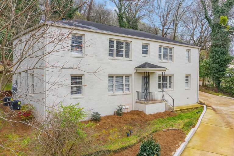 The clean lines of this well-maintained building are complemented by lush greenery, making this property both modern and inviting. The clean lines of this well-maintained building are complemented by lush greenery, making this property both modern and inviting.