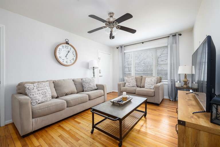 Flooded with natural light, this spacious living room is perfect for lounging, working, or entertaining. Flooded with natural light, this spacious living room is perfect for lounging, working, or entertaining.