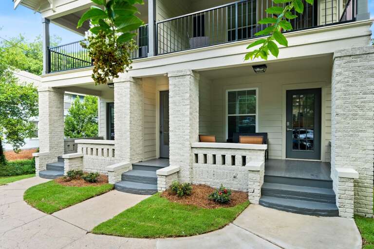 Relax on the cozy porch of Unit 2, perfect for enjoying the quiet neighborhood vibe with a morning coffee or winding down in the evening. Relax on the cozy porch of Unit 2, perfect for enjoying the quiet neighborhood vibe with a morning coffee or winding down in the evening.