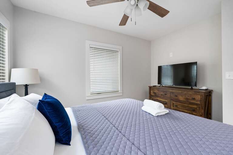 Another view of the King Bedroom, equipped with a smart TV and cozy linens. Another view of the King Bedroom, equipped with a smart TV and cozy linens.