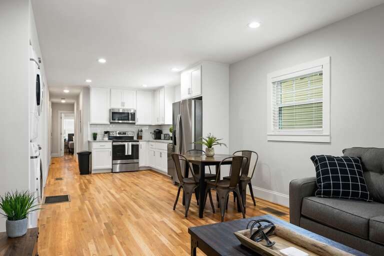 Experience open-plan living with this seamless transition from the stylish living area to the modern kitchen, designed for your comfort and convenience.