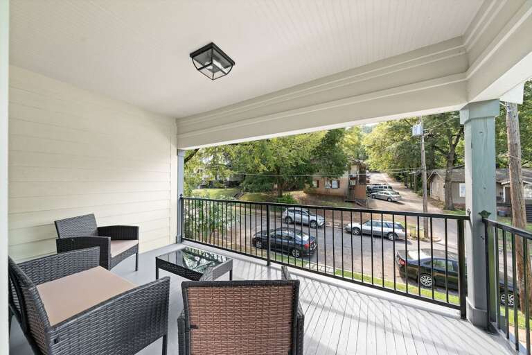 A private balcony that offers an outdoor retreat with comfortable seating and views of the vibrant surroundings.