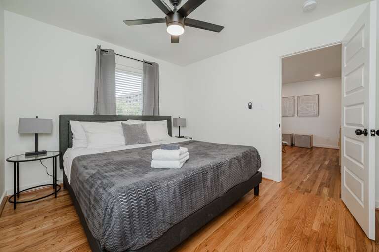 Contemporary bedroom setup emphasizing comfort and style, complete with elegant furnishings.