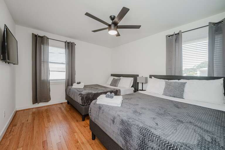 Relax in comfort with soft linens and tranquil decor.