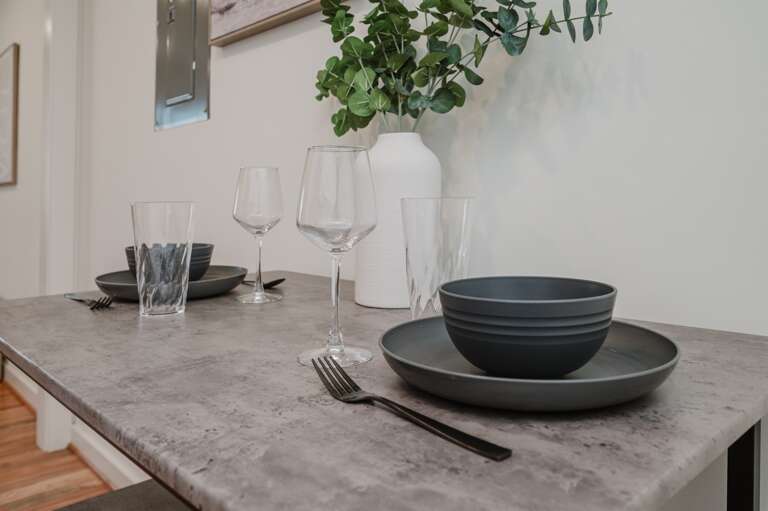 Perfect for meals and gatherings, featuring a stylish setup with modern elegance.
