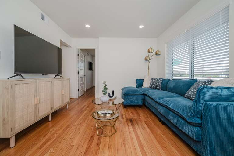 Light-filled living room with direct access to the balcony for an airy, open feel. Light-filled living room with direct access to the balcony for an airy, open feel.