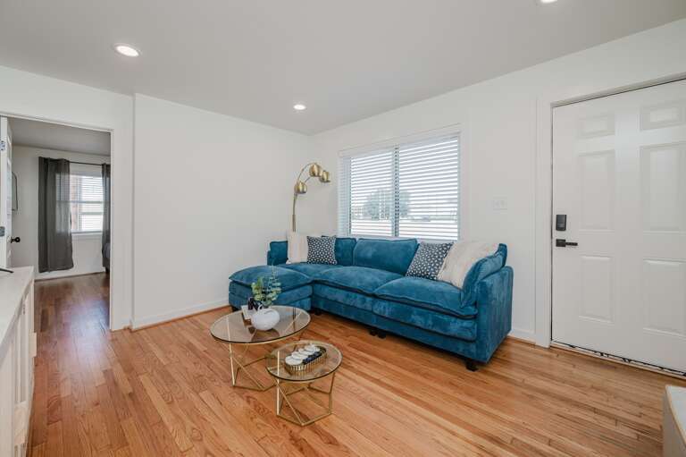 Spacious living room with comfortable seating and modern décor, perfect for relaxation or entertainment. Spacious living room with comfortable seating and modern décor, perfect for relaxation or entertainment.