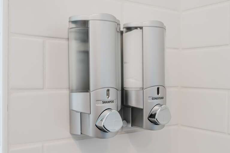 Easily accessible soap dispensers, adding a touch of convenience to your bathroom amenities. Easily accessible soap dispensers, adding a touch of convenience to your bathroom amenities.