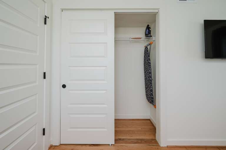 Spacious closet complete with an iron and ironing board for your convenience.