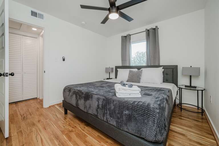 Sleek and simple bedroom design providing a peaceful and uncluttered space. Sleek and simple bedroom design providing a peaceful and uncluttered space.