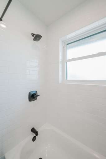 Enjoy a refreshing shower in this modern, well-appointed bathroom. Enjoy a refreshing shower in this modern, well-appointed bathroom.