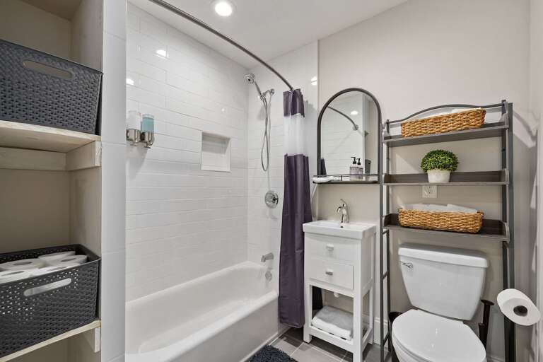 Tub/shower combo bathroom, great for a quick rinse off or a relaxing soak after a long day of exploring. 