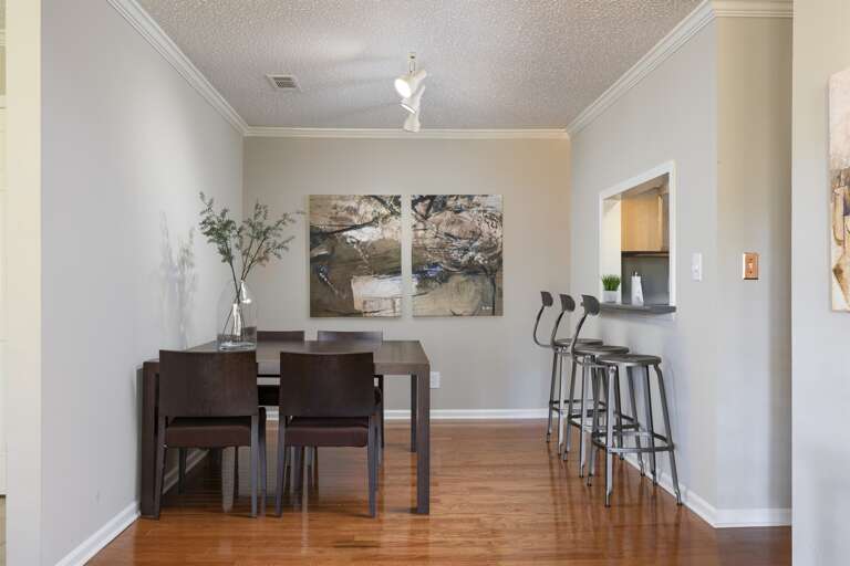 Modern Dining Room: Gather around the dining table in this stylish and well-lit space.