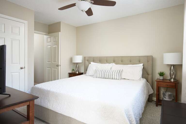 Charming Bedroom Room: A cozy bedroom featuring a plush bed and serene ambiance for a restful stay.
