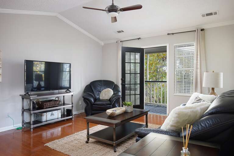 Entertainment Area: Enjoy a flat-screen TV and modern decor for your entertainment needs.