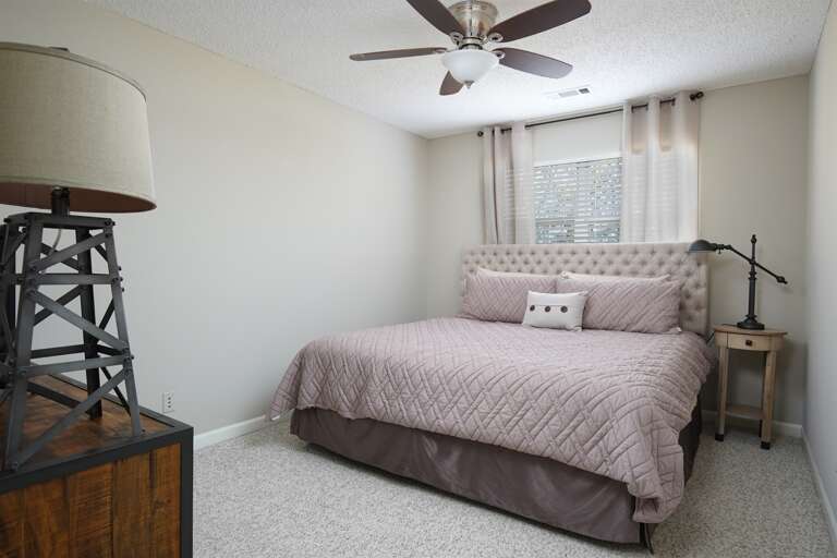 Cozy Bedroom: A warm and inviting bedroom with soft bedding and a serene atmosphere for relaxation.