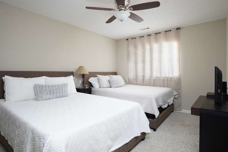 Primary Bedroom: A large and stylish primary bedroom with a calming atmosphere and ample natural light.