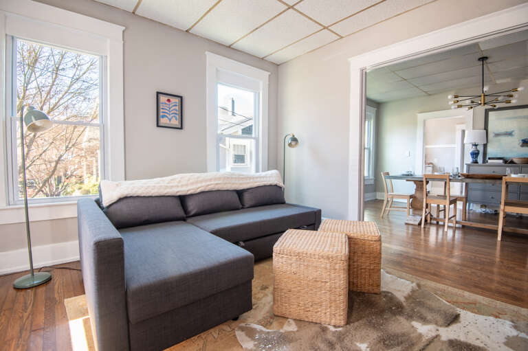 Open-concept living and dining space with modern furnishings and abundant natural light.