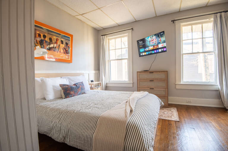 Charming bedroom corner with artful decorations and a serene ambiance.