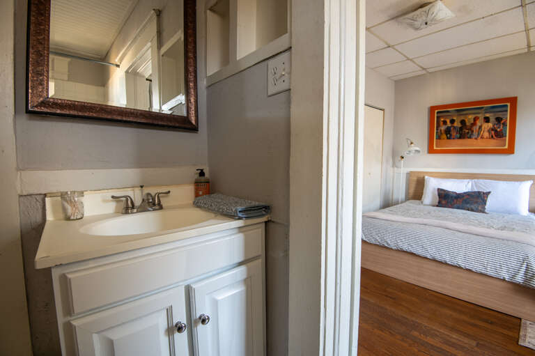 En suite bathroom with sleek built-ins and modern fixtures for added convenience and style.