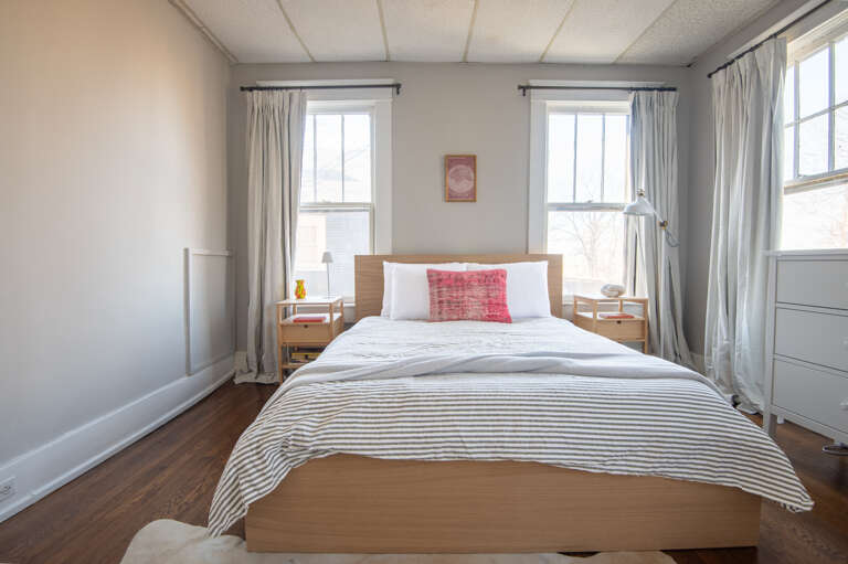 Spacious and inviting bedroom with elegant furnishings and soft lighting.