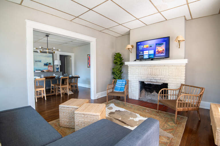 Living room with modern amenities and ample natural light.