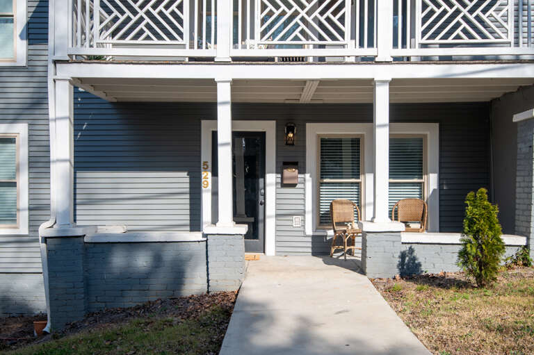 Welcome home! The inviting front entrance and cozy porch seating set the tone for a relaxing stay. Welcome home! The inviting front entrance and cozy porch seating set the tone for a relaxing stay.