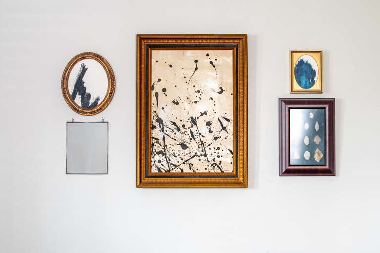 Unique collection of framed artwork from local artists creating a sophisticated and artistic ambiance Unique collection of framed artwork from local artists creating a sophisticated and artistic ambiance