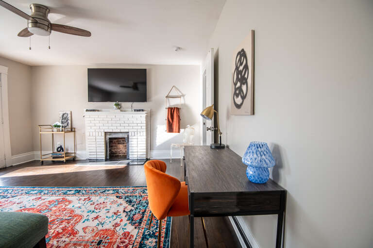 Spacious and comfy living space with a desk for your at-home work needs. Spacious and comfy living space with a desk for your at-home work needs.