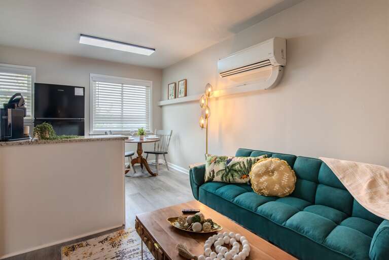 Spacious and inviting living room, beautifully integrating living and dining areas.