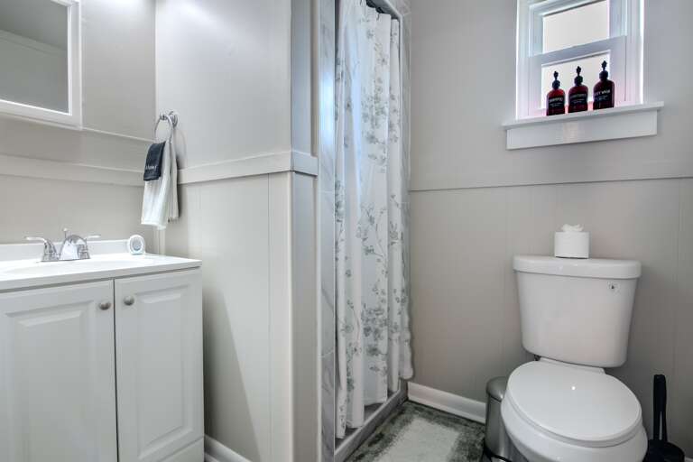 Modern bathroom with sleek fixtures, clean lines, and a sophisticated design.