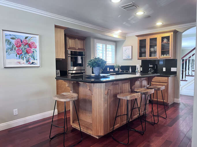 Kitchen Counter Corner, Bar Stools Beneath, Black Appliances Kitchen Counter Corner, Bar Stools Beneath, Black Appliances