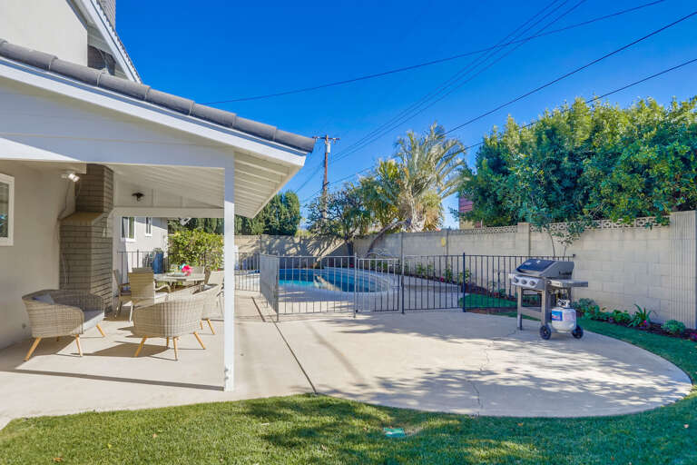Outdoor seating with pool and grill