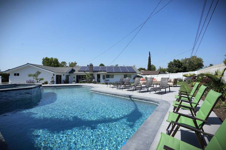 with 5 chaise lounges and extra pool chairs