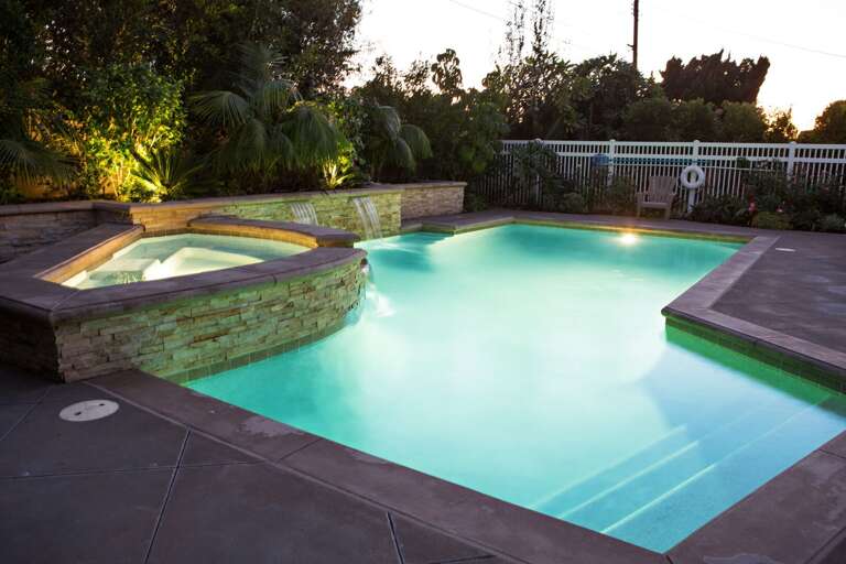 In-ground Pebble-Tech Pool w/Jacuzzi at Dusk