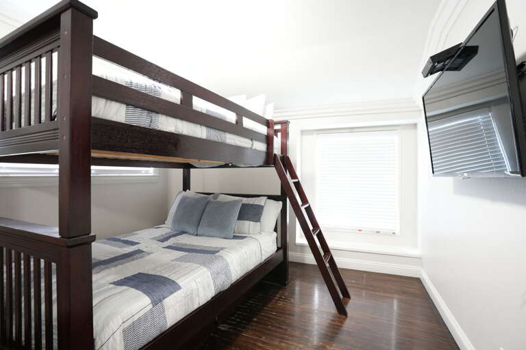 Bedroom #4 Full over Full Bunks with TV. Mirror wardrobe closet