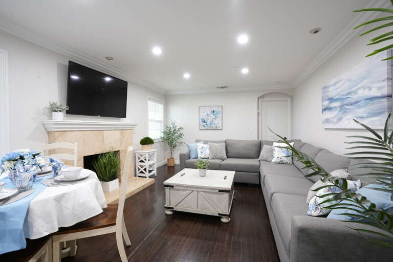 Family Room view 2. Front door on the right, open concept kitchen and dining room on the left. One master and 2 bunk bedrooms down the hallway.