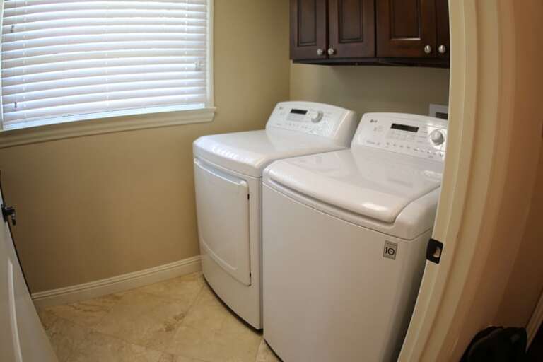 White Washers In A Tight Tan Tiled Room