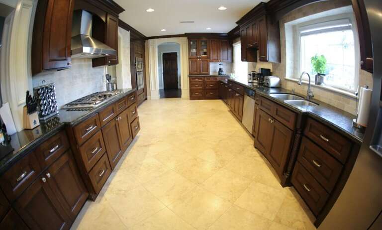 Gourmet Kitchen w/Granite Counter and Stainless Steel Appliances and Travertine Floors