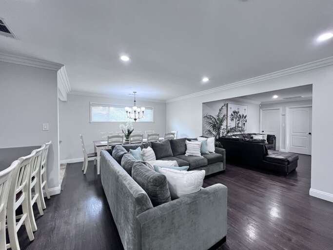 Spacious Living Space, Sleek Sofa Set, Shining Surfaces, Subtle Shades